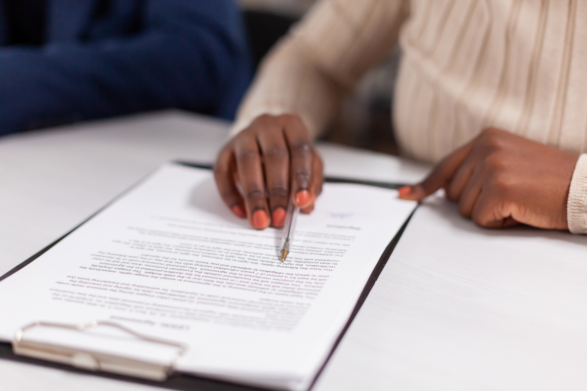 African American Woman Signing Estate Planning Documents