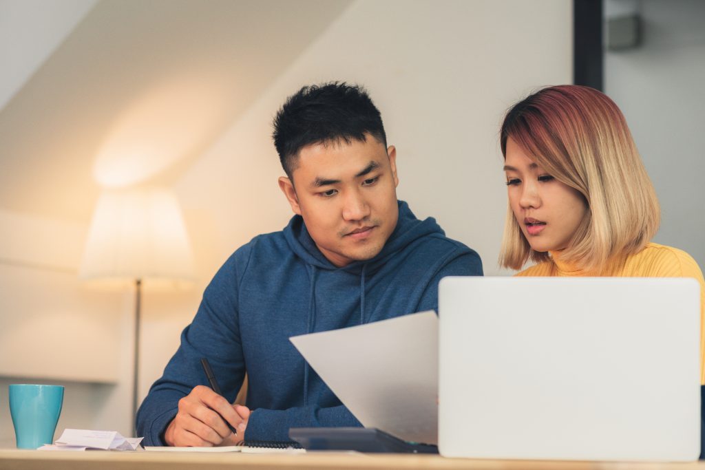 Young couple reviewing their accounts.