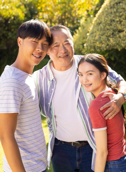 smiling-father-and-teenage-son-and-daughter-posing-2025-04-03-07-03-17-utc_Copy2 Durable power of attorney document with a pen symbolizing legal authority