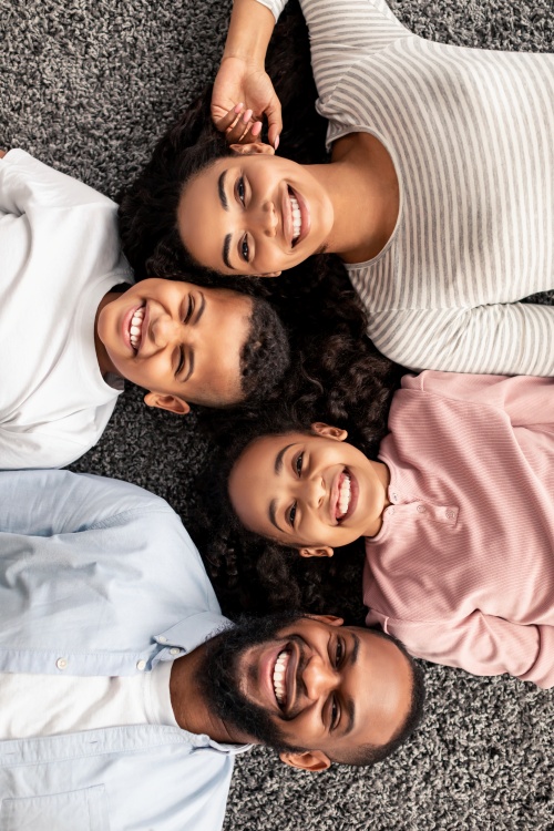 portrait-of-black-family-lying-on-floor-together_Edited Durable power of attorney document with a pen symbolizing legal authority